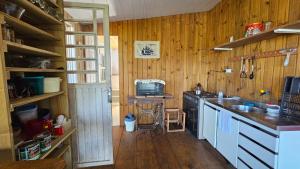 a kitchen with a sink and a counter top at Casa ceu in Florianópolis