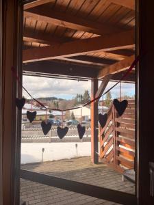 a view of a door with hearts hanging from it at Siebert Apartment in Titisee-Neustadt +10 photos