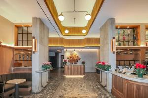 a lobby of a hotel with a bar at Merchant LES Hotel in New York