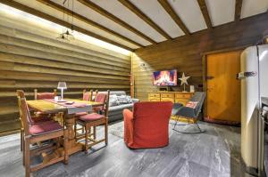 a living room with a table and a couch at Anima Alpina in Morgex