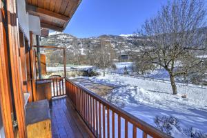 a balcony of a house with snow on the ground at Anima Alpina in Morgex