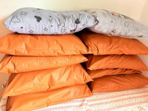 a pile of pillows on top of each other at Chacara Vale do Barreiro in Taubaté +26 photos