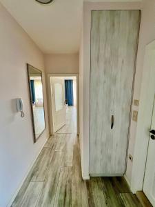 an empty hallway with a door and a mirror at La Mer Prime Time in Varna City +16 photos