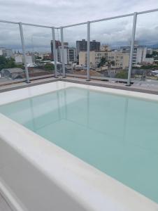 a swimming pool on the roof of a building at Joy Tower by FMA Coliving in Salta