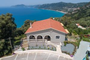 an aerial view of a house with a red roof at Irida sunset in Pentátion