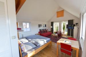 a bedroom with a bed and a living room at Apartment Haak in Halle Westfalen