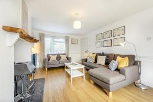 a living room with a couch and a fireplace at 3 Bed in Croyde oc-s34664 in Croyde