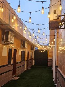 an empty alley with lights on the side of a building at Green Zen Studio Metro 15 mins walk away in Dubai