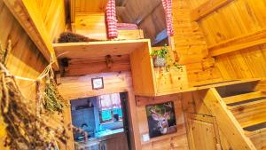 an inside view of a tree house with a staircase at Finnhütte bei GRETA in Marl