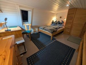 a small bedroom with a bed in a room at Ferienwohnung Eule in Schönwald