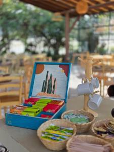 a box of stationery on a table with baskets at Pietra Hotel in Sáchica