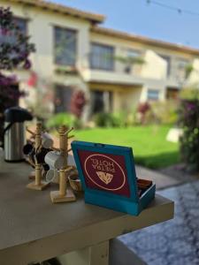 a box sitting on a table in front of a house at Pietra Hotel in Sáchica