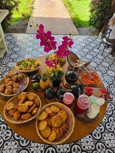 a table with many baskets of food on it at Pietra Hotel in Sáchica