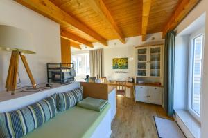 a living room with a couch and a table at Apartment Haak in Halle Westfalen