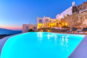 a swimming pool in a villa at night at Boutique Villa Aquata Private pool in Mikonos
