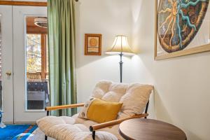 a living room with a chair and a table at Healing House - Healing Escape in Berkeley Springs