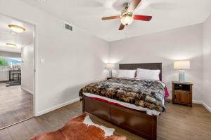 a bedroom with a bed and a ceiling fan at Cowboy Hideout in Sedona +10 photos