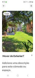 a screenshot of a webpage of a yard with a tree at Loft centro do universo in Arroio do Sal