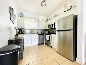 a large kitchen with a stainless steel refrigerator at Sunset Bliss in Abbeyville +13 photos