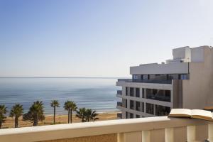 a view of the ocean from the balcony of a hotel at Penthouse Pink seafront in La Mata
