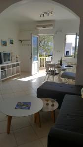 a living room with a couch and a table at Apartment Damir in Mali Ston