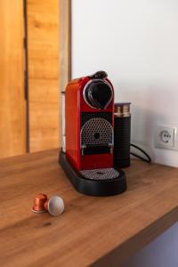 a red toaster sitting on top of a counter at Gemütliches Gästezimmer mit gemeinsamer Küche, Wohnzimmer & Balkon in Nassereith +12 photos