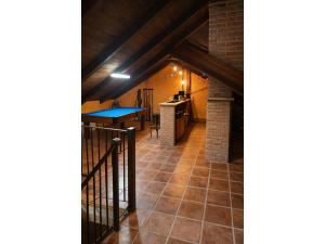 a room with a ping pong table in a attic at Chalet in Rivero de Posadas with Pool in Rivero de Posadas +15 photos