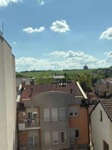 an apartment building with a view of a field at Nik 2 in Kruševac
