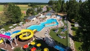 an aerial view of a water park with a water slide at Chaleureux Tiny Home à 45 mn du Zoo de Beauval in Veuzain-sur-Loire