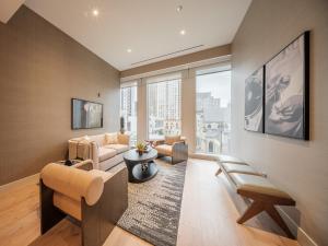 a living room with a couch and a table at Stay One Chicago in Chicago