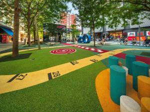 a park with a target painted on the grass at Apartmani Mursa-blizina KBC Osijek in Osijek