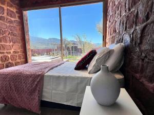 a bedroom with a bed and a large window at Villa Al Firdaous in Tiznit +28 photos