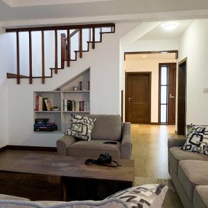 a living room with a couch and a table at Zuri's Beachfront Bliss, With Beach Access -Sultan Palace in Mtwapa