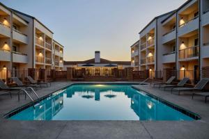 a pool in the courtyard of a hotel at Courtyard by Marriott Huntsville University Drive in Huntsville
