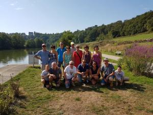 a group of people posing for a picture next to a lake at Gîte Chez habitant in Telouet +15 photos