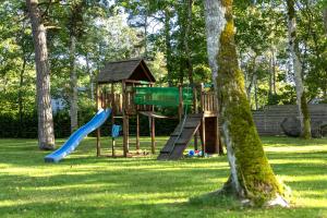 a playground in a park with a slide at The Peaceful Vacation in Muratsi