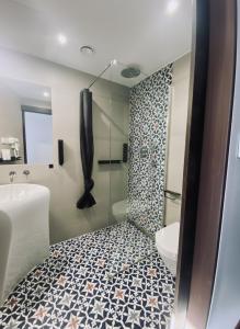 a bathroom with a shower and a sink and a toilet at Topolove Rooms & Apartments in Krakow +52 photos