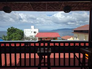 a view of the ocean from a balcony at Romantic Ocean View A-Frame with Shore Diving Access - Aloha Aina Dive Resort in Mabini