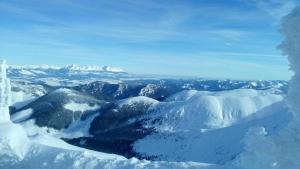 an aerial view of a mountain covered in snow at Ubytovanie michaela in Bešeňová +4 photos