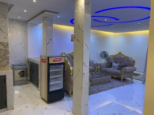 a lobby with a coca cola machine in a room at Résidence Salt Lake in Pikine