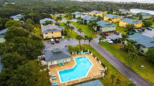 an aerial view of a home with a swimming pool at Fair Seas Clipper Condo for 6 in Saint Augustine Beach