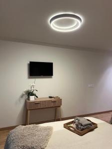a living room with a flat screen tv on a wall at Luméa 126 in Éguilles