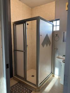 a bathroom with a shower and a sink at Casa Quinta Real in Cedro