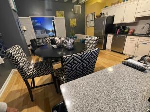 a kitchen with a table and chairs in a room at The Samone's in Atlanta