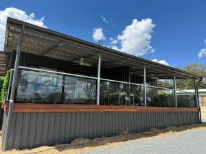 a building with windows on the side of it at Banksia apartment - Escape to Serene Rural Bliss! in Inverell