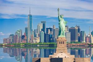a view of the statue of liberty in front of a city at Private Room at a Shared Apartment by Times Square in New York