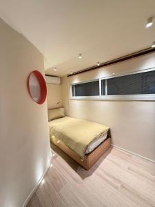 a small bedroom with a bed on a boat at Beit'roun 2BR Apartment in Batroun in Batroûn