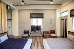 Postel nebo postele na pokoji v ubytování 宜蘭81 Boat輕旅 寵物友善 小團體包棟 獨棟villa + 37 fotografií