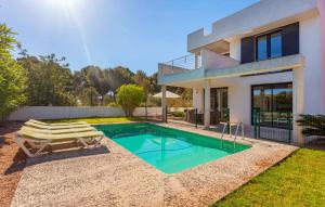 a villa with a swimming pool and a house at Oasis N'aguait in Cala Ratjada