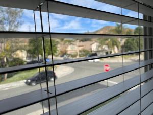 a window with a view of a street at LA Lux Suite with Private Bathroom in Santa Clarita